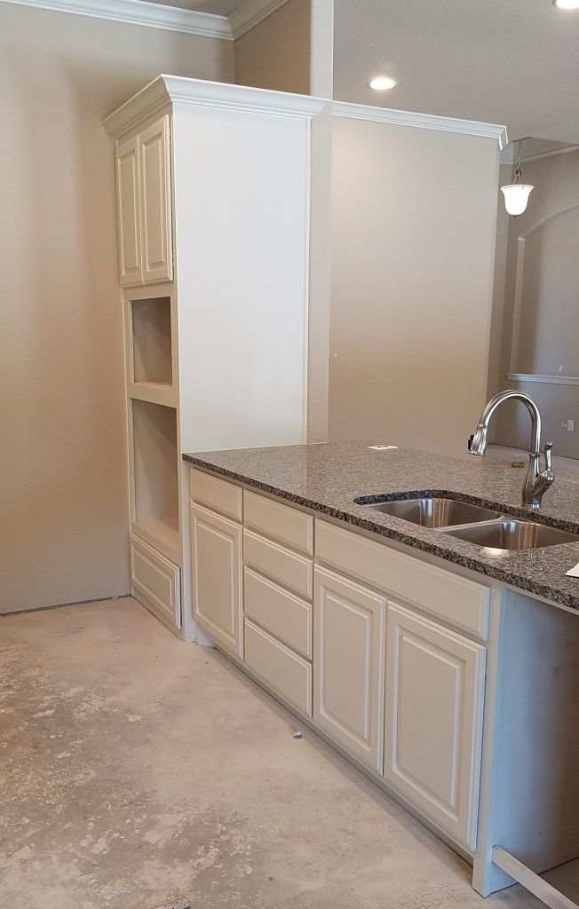 Sink, and oven and microwave area :: Harrison Homes